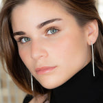 Pendientes riviere de plata rodiada, o con baño de oro 18k, con circonitas blancas de 2 mm y 3 o 7 cm de largo.