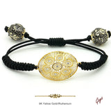 Pulsera de macramé negro con medallón de filigrana en oro 9K